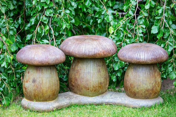 Three mushrooms seating garden bench whimsical cement outdoor stools